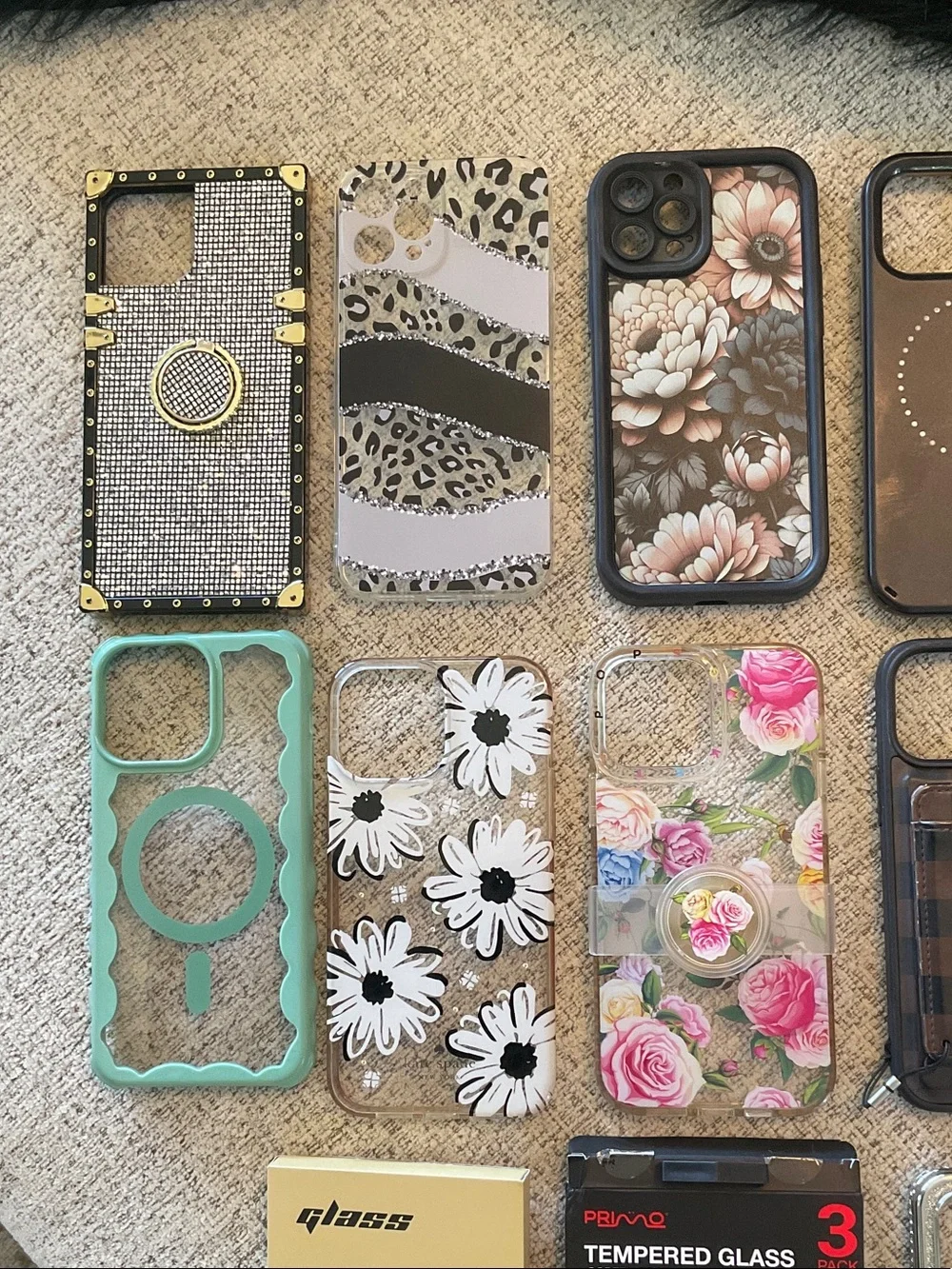 Assorted IPhone 12 Pro Max Phone cases and Screen Protectors